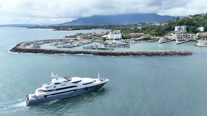 Aerial view of a yacht approaching Ocean World Marina